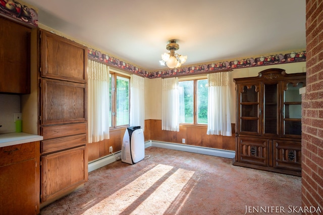 9546 Benham St NE, Cedar Springs, MI 49319 - dining area with a baseboard radiator, plenty of natural light, and a chandelier
