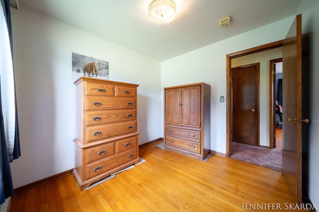 9546 Benham St NE, Cedar Springs, MI 49319 - bedroom with light wood-type flooring and baseboards