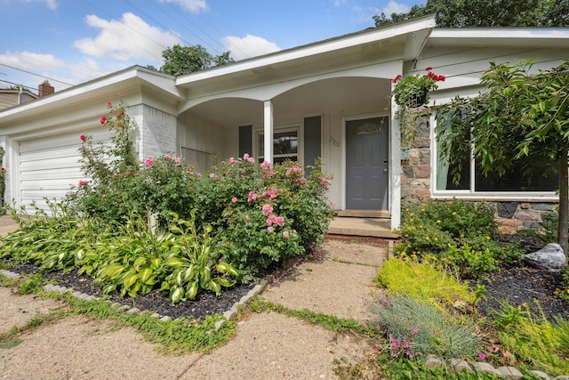 2362 Georgetown Blvd, Ann Arbor, MI 48105 - view of front of property with an attached garage, covered porch, stone siding, and brick siding