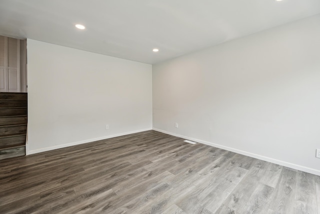 2362 Georgetown Blvd, Ann Arbor, MI 48105 - empty room featuring wood finished floors, recessed lighting, and stairway