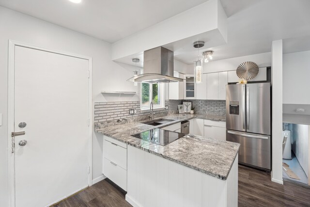 2362 Georgetown Blvd, Ann Arbor, MI 48105 - kitchen with stainless steel appliances, island range hood, a peninsula, white cabinetry, and light stone countertops
