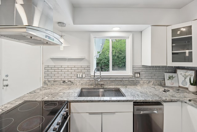 2362 Georgetown Blvd, Ann Arbor, MI 48105 - kitchen with exhaust hood, appliances with stainless steel finishes, white cabinets, tasteful backsplash, and light stone countertops
