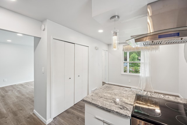2362 Georgetown Blvd, Ann Arbor, MI 48105 - kitchen featuring wall chimney exhaust hood, range, wood finished floors, recessed lighting, and pendant lighting