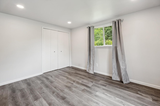 2362 Georgetown Blvd, Ann Arbor, MI 48105 - unfurnished bedroom featuring wood finished floors, recessed lighting, and a closet