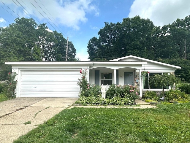 2362 Georgetown Blvd, Ann Arbor, MI 48105 - view of front facade with concrete driveway, a front yard, a garage, and covered porch