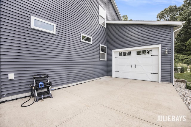 12828 Bayou Ct, Wayland, MI 49348 - view of side of home featuring driveway and an attached garage