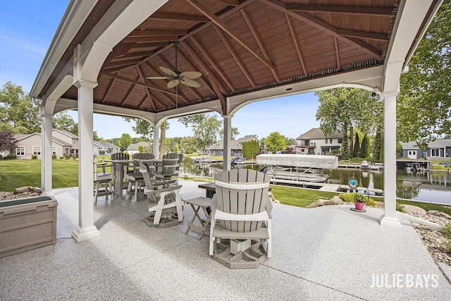 12828 Bayou Ct, Wayland, MI 49348 - view of patio / terrace with a gazebo, ceiling fan, a water view, and a residential view