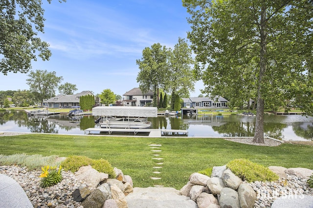 12828 Bayou Ct, Wayland, MI 49348 - dock area featuring a water view, boat lift, a lawn, and a residential view