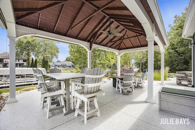 12828 Bayou Ct, Wayland, MI 49348 - view of patio / terrace featuring a gazebo, outdoor dining area, and a ceiling fan