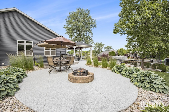 12828 Bayou Ct, Wayland, MI 49348 - view of patio featuring an outdoor fire pit and outdoor dining area
