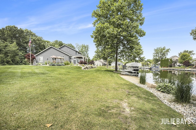 12828 Bayou Ct, Wayland, MI 49348 - view of green lawn with a water view