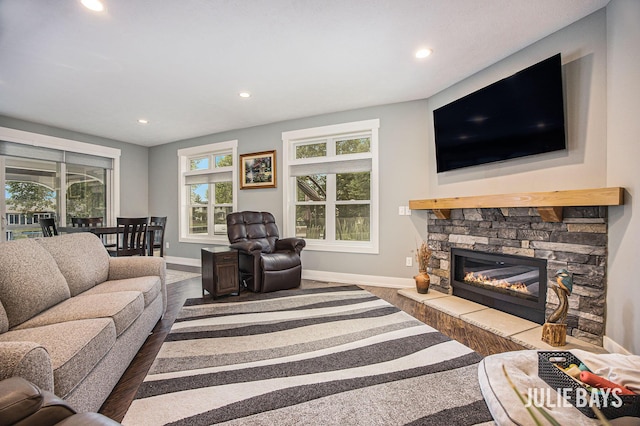 12828 Bayou Ct, Wayland, MI 49348 - living room with dark wood-type flooring, recessed lighting, and a fireplace