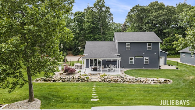 12828 Bayou Ct, Wayland, MI 49348 - rear view of house featuring a patio area, a lawn, a garage, and a shingled roof