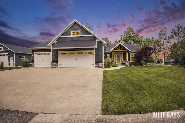 12828 Bayou Ct, Wayland, MI 49348 - craftsman house featuring board and batten siding, stone siding, concrete driveway, a front lawn, and an attached garage