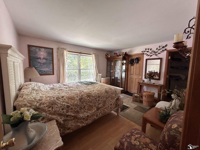 1645 N M-65 Rd, Curran, MI 48728 - bedroom with light wood-style floors