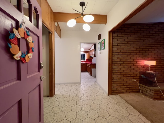 3431 Pineview Dr, Dexter, MI 48130 - corridor with beam ceiling and brick wall