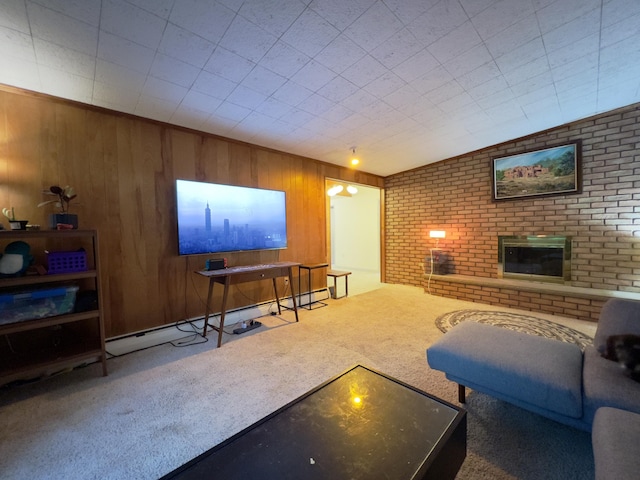 3431 Pineview Dr, Dexter, MI 48130 - living area with carpet floors, a baseboard radiator, a fireplace, and wooden walls
