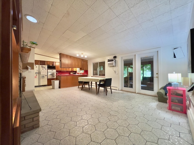 3431 Pineview Dr, Dexter, MI 48130 - dining room featuring a wall mounted air conditioner