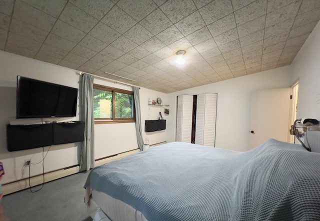 3431 Pineview Dr, Dexter, MI 48130 - carpeted bedroom featuring a baseboard radiator
