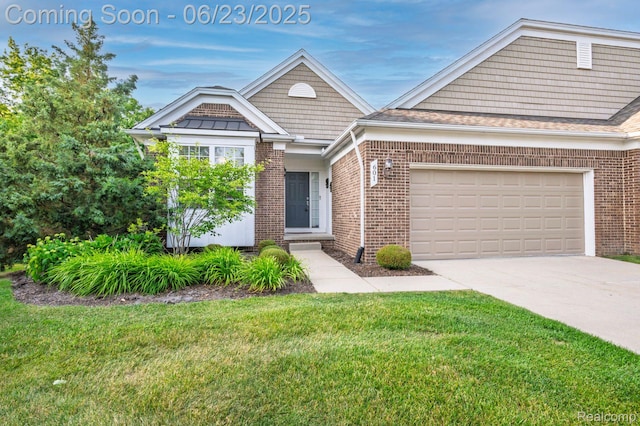 601 Acadia Ct, Howell, MI 48843 - view of front of home featuring brick siding, a front yard, concrete driveway, and a garage