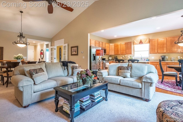 601 Acadia Ct, Howell, MI 48843 - living room with ceiling fan, light carpet, recessed lighting, and high vaulted ceiling