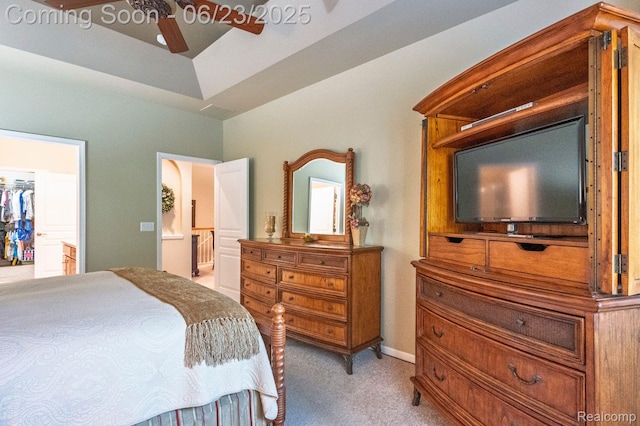 601 Acadia Ct, Howell, MI 48843 - bedroom with light colored carpet, a spacious closet, ensuite bathroom, and a ceiling fan