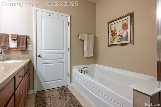601 Acadia Ct, Howell, MI 48843 - bathroom with a garden tub, vanity, and tile patterned flooring