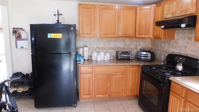 27038 Grobbel Dr, Warren, MI 48092 - kitchen featuring black appliances, under cabinet range hood, light tile patterned flooring, backsplash, and light countertops