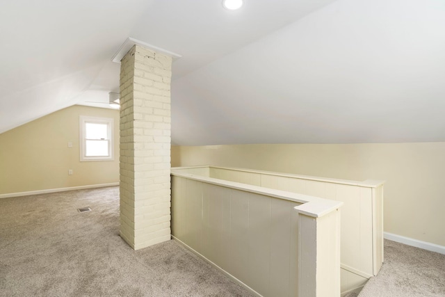 11706 Auburn St, Detroit, MI 48228 - additional living space with lofted ceiling, light carpet, and decorative columns