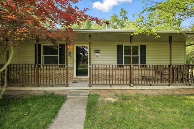 26434 King Rd, Romulus, MI 48174 - single story home with a porch and a front lawn
