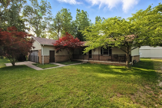 26434 King Rd, Romulus, MI 48174 - view of green lawn featuring a porch
