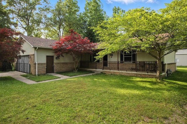 26434 King Rd, Romulus, MI 48174 - view of property hidden behind natural elements with brick siding, a front lawn, covered porch, a garage, and a shingled roof