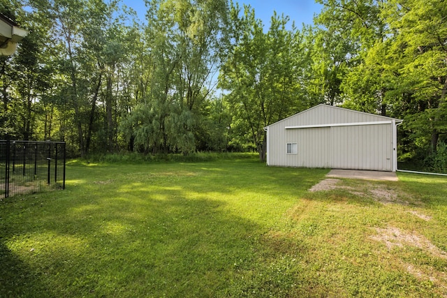 26434 King Rd, Romulus, MI 48174 - view of green lawn with a pole building, a garage, and an outbuilding