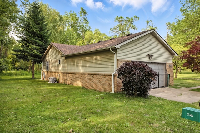 26434 King Rd, Romulus, MI 48174 - view of home's exterior featuring brick siding, a lawn, and a garage
