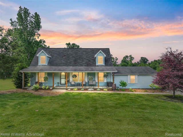 26855 King Rd, Brownstown, MI 48174 - view of front of home with covered porch and a lawn