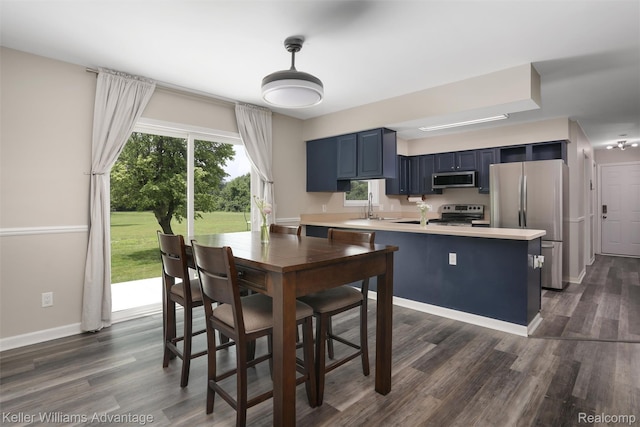 26855 King Rd, Brownstown, MI 48174 - dining space with healthy amount of natural light and dark wood finished floors