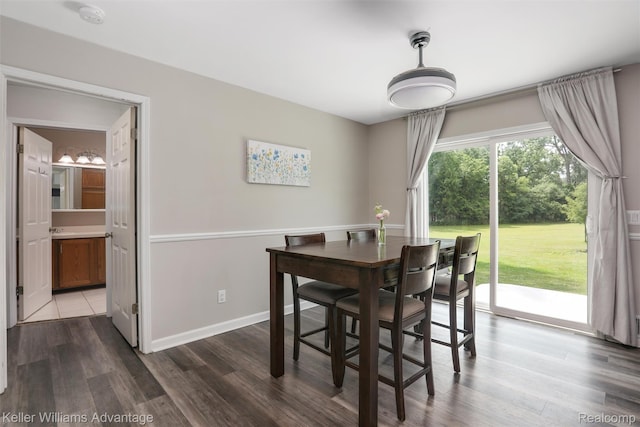26855 King Rd, Brownstown, MI 48174 - dining area featuring dark wood-type flooring and baseboards