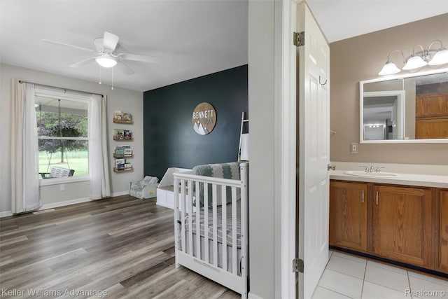 26855 King Rd, Brownstown, MI 48174 - bedroom featuring a crib and light wood-type flooring