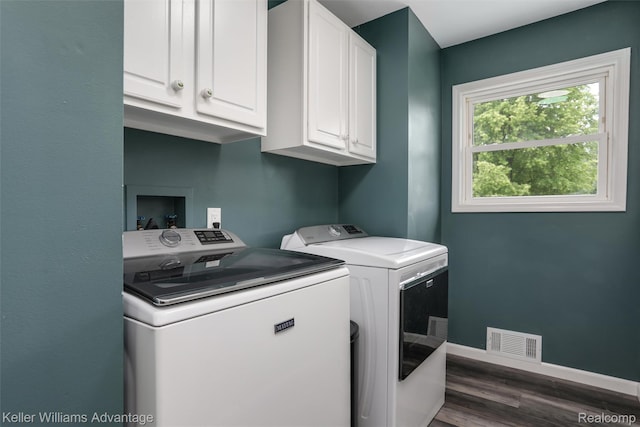 26855 King Rd, Brownstown, MI 48174 - washroom with cabinet space, washing machine and clothes dryer, and dark wood finished floors