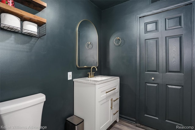 26855 King Rd, Brownstown, MI 48174 - half bathroom featuring vanity and wood finished floors