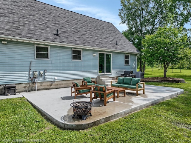 26855 King Rd, Brownstown, MI 48174 - back of property with an outdoor living space with a fire pit, entry steps, a patio area, and a lawn