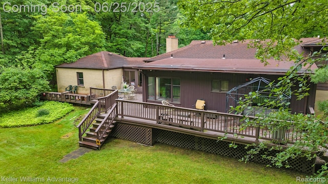 29866 Woodland Dr, Southfield, MI 48034 - rear view of property featuring a chimney, a lawn, a wooden deck, and a shingled roof