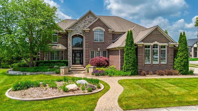 56343 Via Serbelloni, Macomb, MI 48042 - view of front of property with brick siding and a front lawn