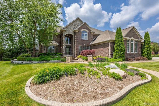 56343 Via Serbelloni, Macomb, MI 48042 - traditional home featuring brick siding and a front lawn