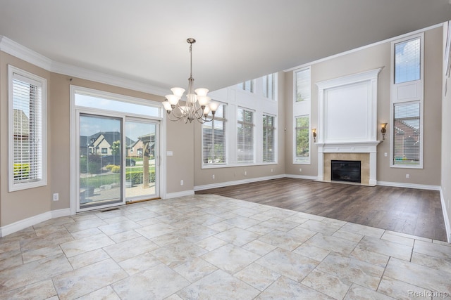56343 Via Serbelloni, Macomb, MI 48042 - unfurnished living room with stone tile floors, plenty of natural light, a chandelier, and ornamental molding