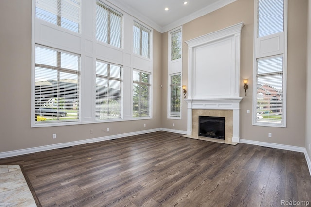 56343 Via Serbelloni, Macomb, MI 48042 - unfurnished living room with ornamental molding, dark wood-type flooring, a tile fireplace, and a high ceiling