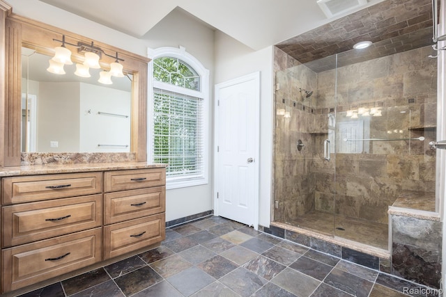 56343 Via Serbelloni, Macomb, MI 48042 - bathroom with vanity, a stall shower, and stone finish flooring