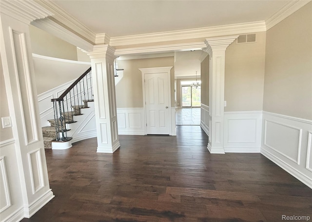 56343 Via Serbelloni, Macomb, MI 48042 - foyer featuring decorative columns, a decorative wall, dark wood-type flooring, ornamental molding, and stairs
