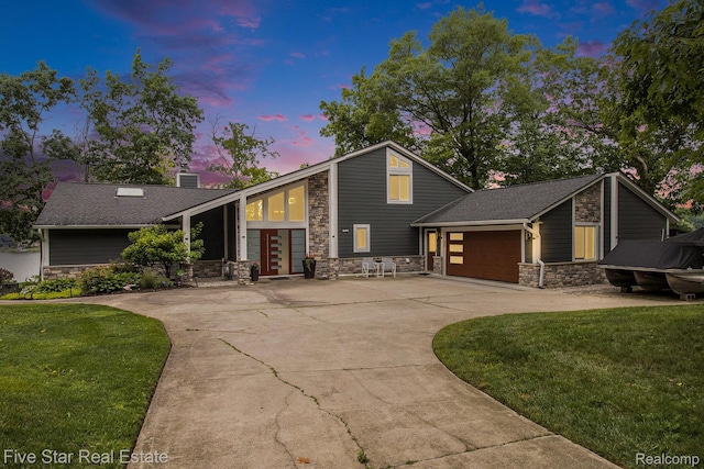7025 Dandison Blvd, West Bloomfield, MI 48324 - mid-century inspired home with stone siding, driveway, a front lawn, and a garage