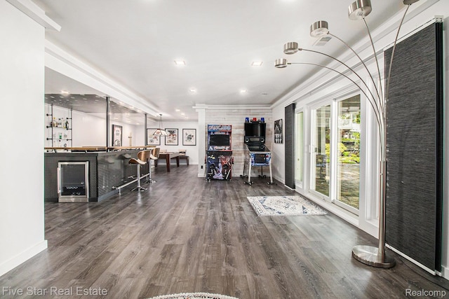 7025 Dandison Blvd, West Bloomfield, MI 48324 - miscellaneous room featuring a bar, wood finished floors, recessed lighting, and ornamental molding